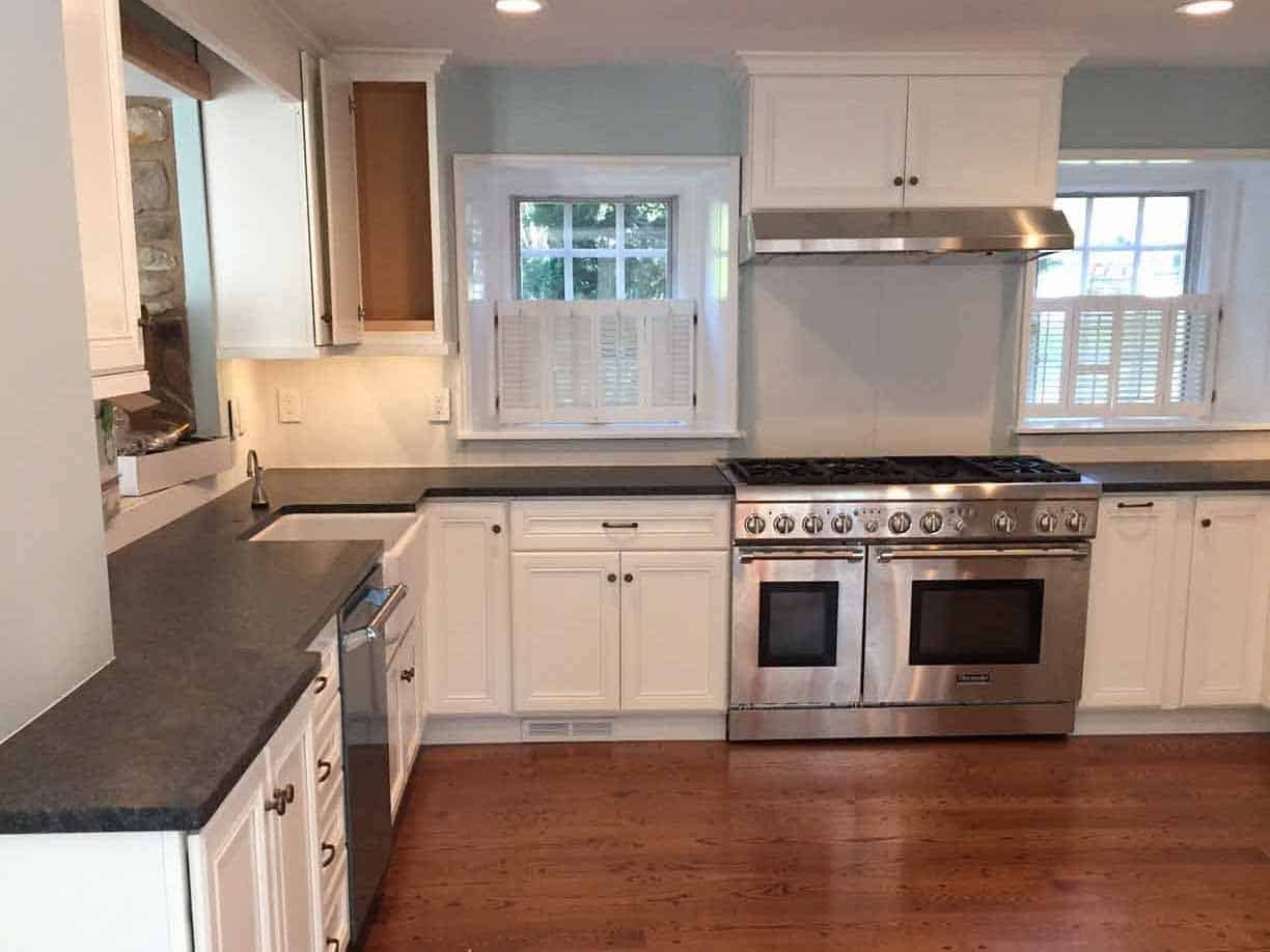 Refinished kitchen with a large stainless steel oven.